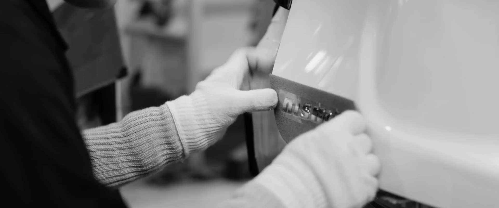 Nissan Note e-POWER NISMO badge being applied